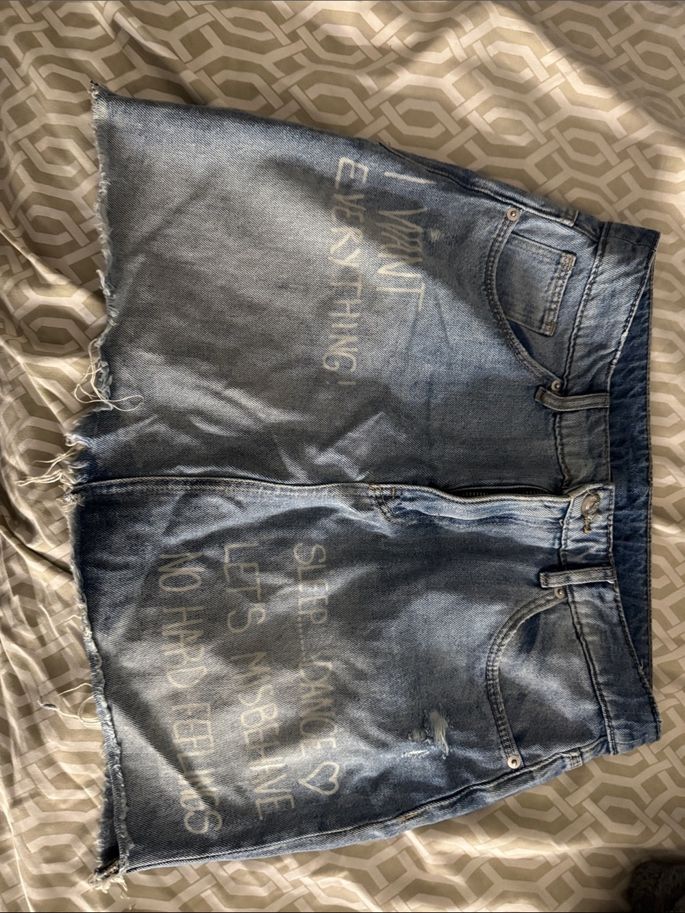 Divided Light Blue Distressed Denim Skirt with Faded White Text